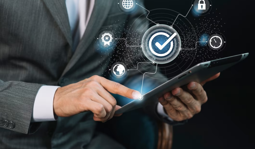 A man holds a tablet in his hands, the concept of access confirmation